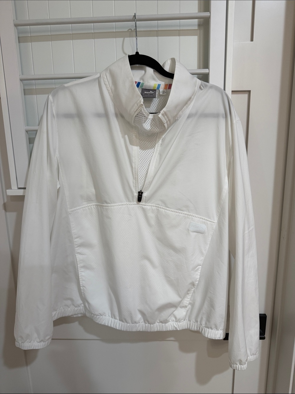 Puma women’s White Mesh Quarter-Zip Top with Multicolor Trim.